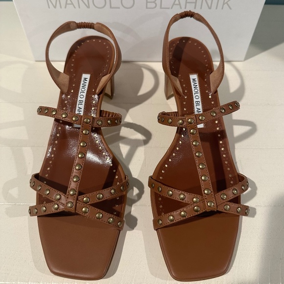 Manolo Blahnik Strappy Stud Sandal is shiny by the silver leather,with straps,slingback at the 